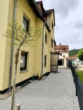 Die Rückseite der Immobilie - Modernisierte 3-Zimmer-Terrassenwohnung mit neuer Einrichtung & großer Süd-/West-Terrasse