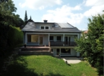 Hier sehen Sie eine Ansicht aus dem Garten - Niedrigenergie-Mehrfamilienhaus in Bad Sachsa – Investieren mit Weitblick!