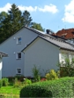 Seitenansicht Hauptgebäude und Garage - Zwei barrierefreie Eigentumswohnungen im Paket +Investieren mit Weitblick in Bad-Sachsa!